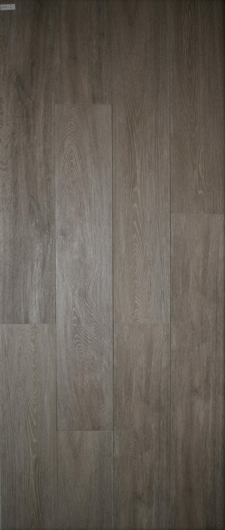 Canada Chestnut is a porcelain tile with wood grains. It looks like wood.