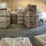 What is Wholesale Tile and How Are Tiles Priced? 1 picture showing a warehouse full of porcelain tiles.