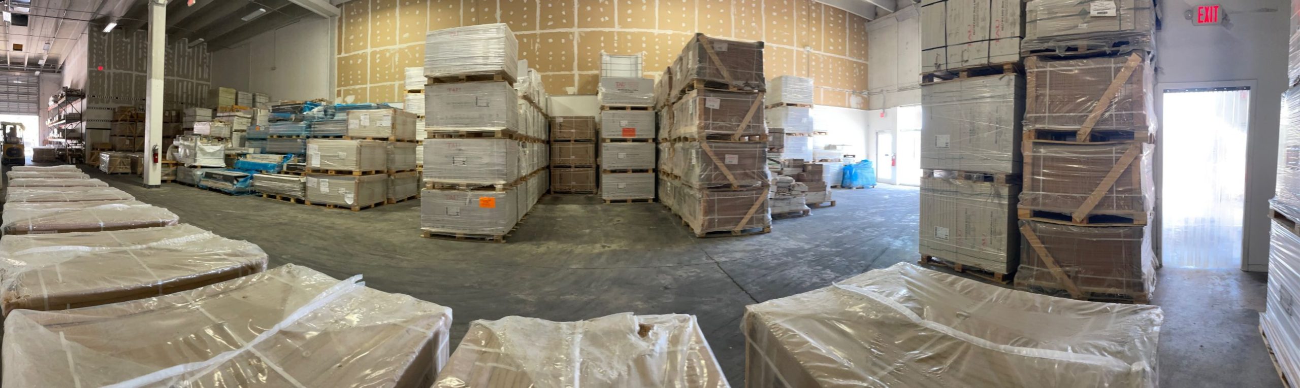 What is Wholesale Tile and How Are Tiles Priced? 3 picture showing a warehouse full of porcelain tiles.