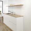 Palin white wall tile with 3D waves that are called wellen