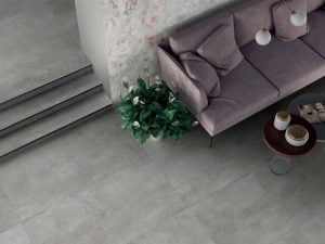 living room scene with polished gray porcelain tile that looks like industrial concrete floors