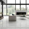 a modern living room seen with a large size square porcelain tile light gray color that looks like marble
