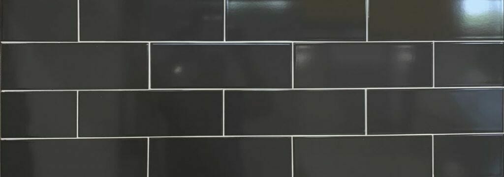 dark grey color glossy subway tile in large size