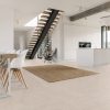 a modern kitchen that feels warm and inviting with a large format beige tile