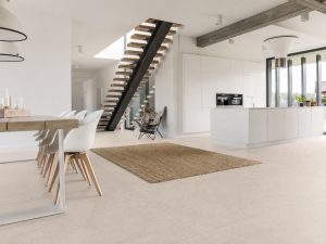 A modern kitchen that feels warm and inviting with a large-format beige tile