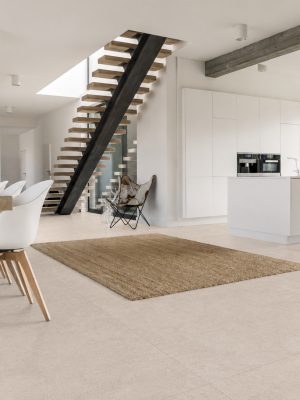 a modern kitchen that feels warm and inviting with a large format beige tile