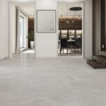 Altamura Silver 48×48 polished porcelain tile in a modern interior, reflective grey limestone look with minimal grout lines.”
