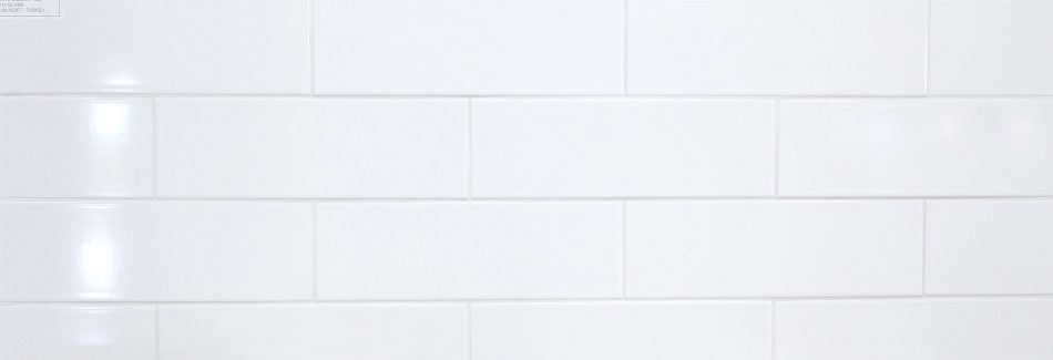 A bigger picture of the large white subway tile with more pieces