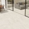 travertine-look tile extending from the interior to the exterior