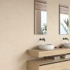 Crema Marfil Porcelain tile satin finish on a bathroom wall