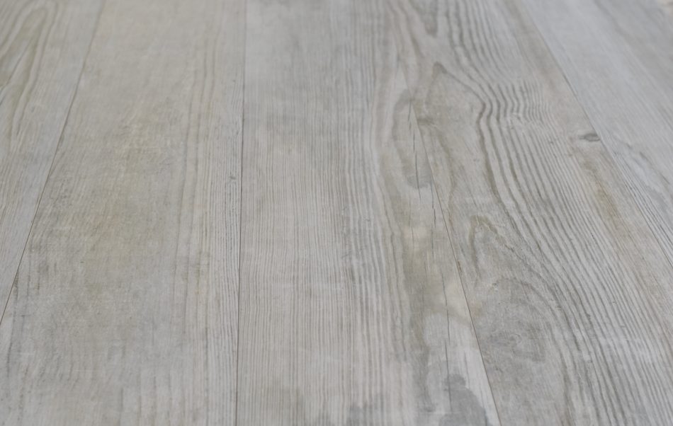 close up picture of Porcelain tile that looks like old wood, whitewashed wood