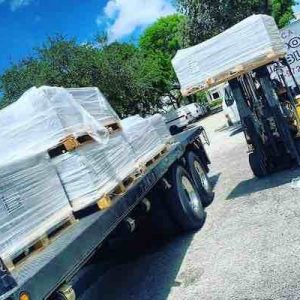 How Much Does Tile Shipping Cost? 9 tile store close to Dania Beach, unloading a truck for the warehouse