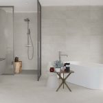 Castillo White 24x48 white concrete look porcelain tile in modern bathroom