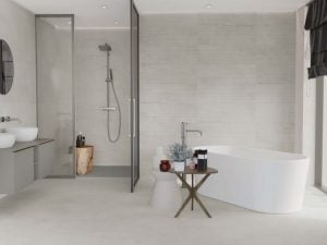 a bathroom floors and wall with concrete style tile in white color