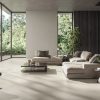 Desigless tile CD Extra White that has hand troweled resin textured in a luxurious modern house with as 48x48 floor, 24x48 wall tile