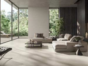 Desigless tile CD Extra White that has hand troweled resin textured in a luxurious modern house with as 48x48 floor, 24x48 wall tile