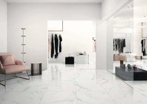 the interior of a boutique with white porcelain tile that looks like marble