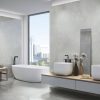 large format polished concrete look tile in a modern bathroom as wall and floor tile