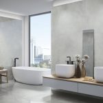 large format polished concrete look tile in a modern bathroom as wall and floor tile