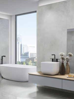 large format polished concrete look tile in a modern bathroom as wall and floor tile