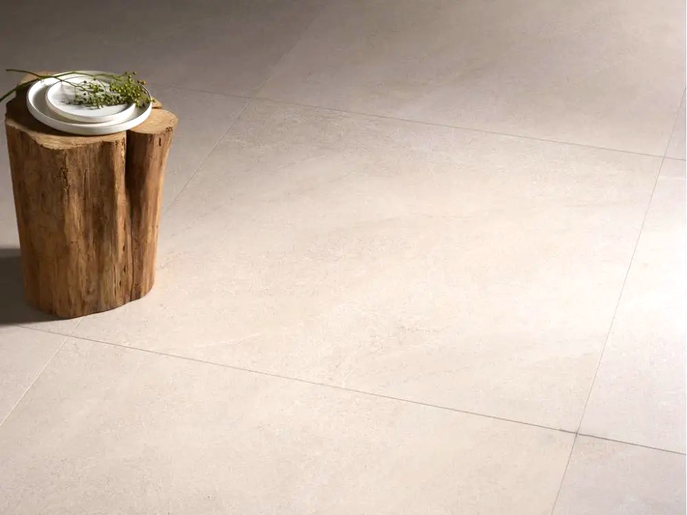 Bringing Nature Home: Biophilic Design 4 close up picture of a floor with 48x48 tile that looks like limestone in very light beige color and minimal design
