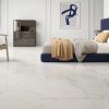 bedroom picture with matte finish white tile that has gold and bluish veining.