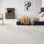 bedroom picture with matte finish white tile that has gold and bluish veining.