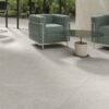 a floor with 48x48 porcelain tile that looks like a limestone in light color