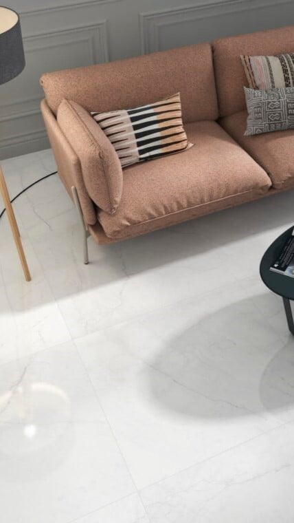 the picture of a living room with a white marble look porcelain tile that has minimal gray veining