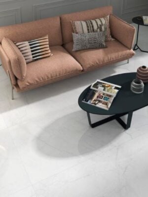 a modern living room with 48x48 porcelain tile that looks like marble with lesser gra veining