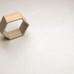 detail picture of a light beige tile with a modern and natural design.