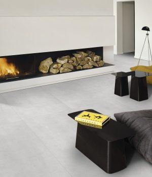 a living room scene with a light gray color 48x48 concrete style tile