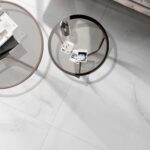 a living room floor with a white onyx porcelain tile that has cloudy movements