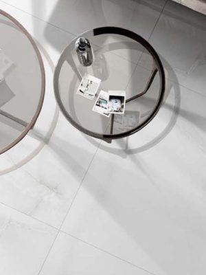 a living room floor with a white onyx porcelain tile that has cloudy movements