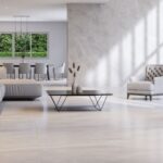 Bringing Nature Home: Biophilic Design 1 a modern interior with big windows that connects with the front yard with furniture and the floor in light earth tones