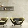Onyx Design 24x48 agate gold tile in a living room wall and floor