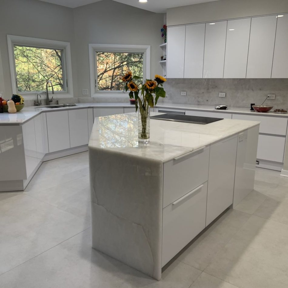 a modern kitchen with 49x48 concrete style tile floors