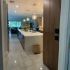 24X48 polished concrete look tile Natron Grey floor in a modern living room and kitchen