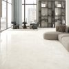 48x48 polished porcelain tile that looks like onyx in a luxurious living room.