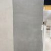 Showroom display of Castillo Gray 24x48 porcelain tiles highlighting their cement-inspired design.