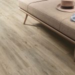 Why Wood Look Porcelain Tiles Are Here to Stay 1 a living room floor close up picture with a beige color wood looking tile