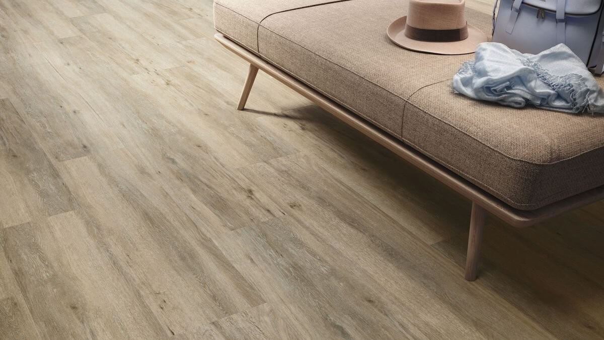 Why Wood Look Porcelain Tiles Are Here to Stay 2 a living room floor close up picture with a beige color wood looking tile
