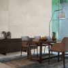 Atelier Lux Sand: Dining area featuring concrete effect porcelain tiles for warmth.