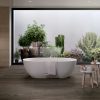 a living room with a large wood look tile that has raw finish in grey color