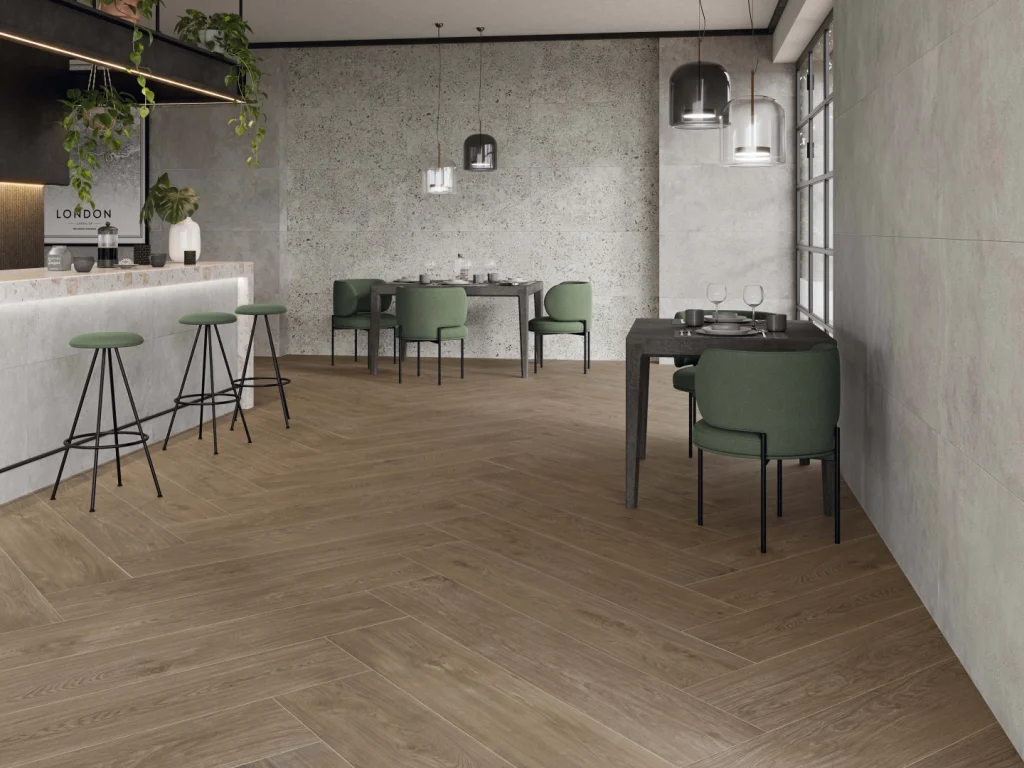 Why Wood Look Porcelain Tiles Are Here to Stay 3 A modern kitchen with a white island and walnut color wood looking porcelain floor