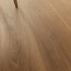 Detail picture showing the grains of a blonde color wood look tile that also has some honey tones