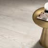 close up picture showing honey white and the raw finish of White Laurel tile