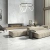 picture showing a white marble style 63x63 inch tile on a living room floor and the accent wall