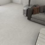 a living room with light gray color concrete look tile