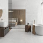 bathroom scene with matte finish 63x63 tile that look like Onyx in very light earth tones on the floor and wall